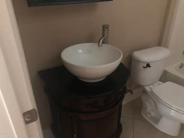 a spacious bathroom with a granite countertop sink mirror and a