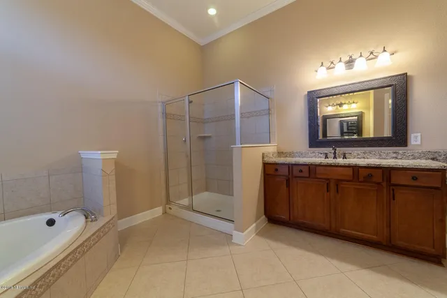 a bathroom with a bathtub and a sink