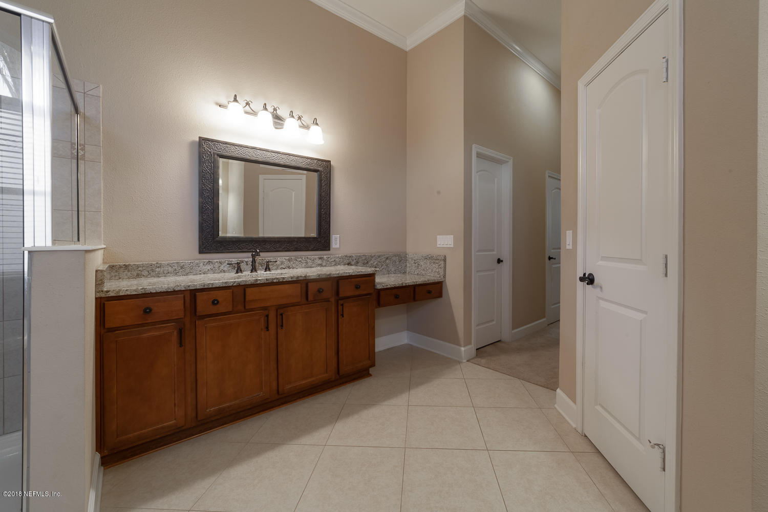 732 Castledale Court St. Johns, FL 32259 - Photo 17 of 51 a bathroom with a sink a mirror and a shower
