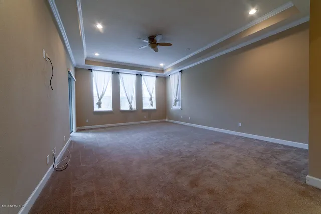 a large kitchen with stainless steel appliances granite countertop a stove a sink and a microwave