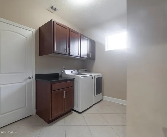 a bathroom with a toilet a sink and bathtub