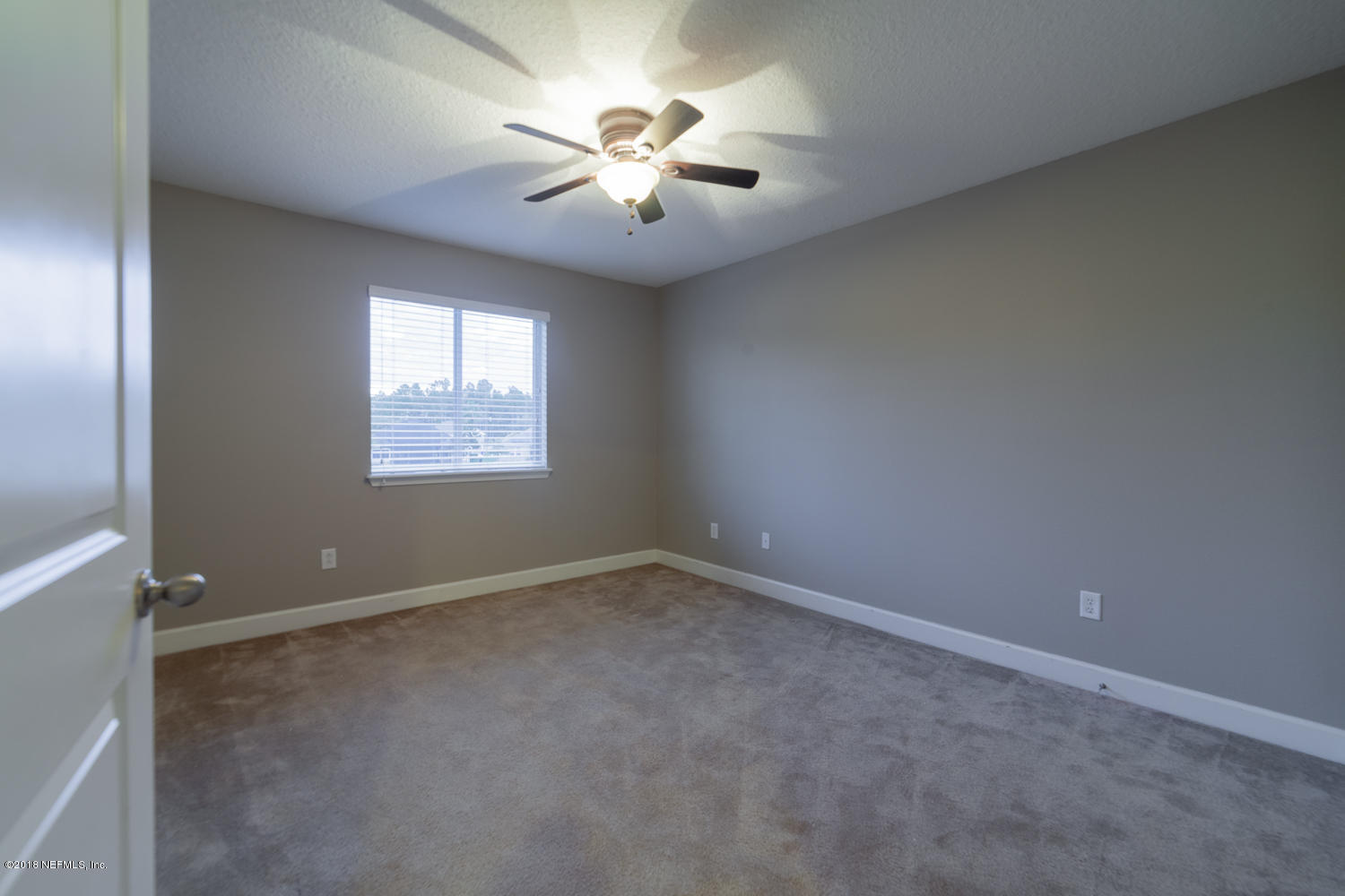 732 Castledale Court St. Johns, FL 32259 - Photo 32 of 51 an empty room with windows and fan