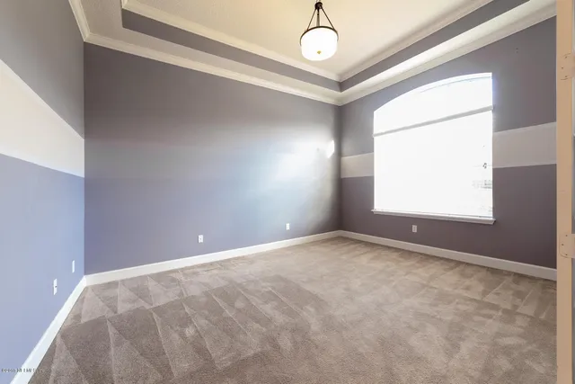 a spacious bathroom with a granite countertop sink mirror and a