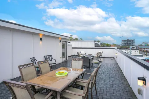 a view of a terrace with furniture