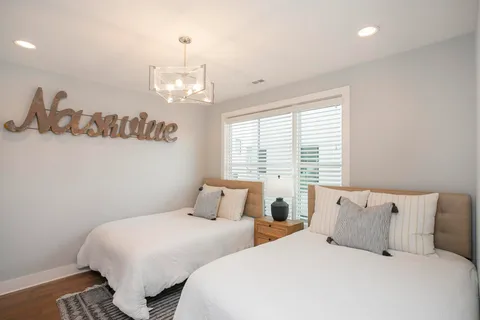 a bedroom with bed and window
