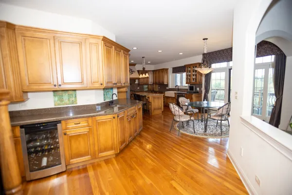 a kitchen with stainless steel appliances granite countertop sink stove and cabinets