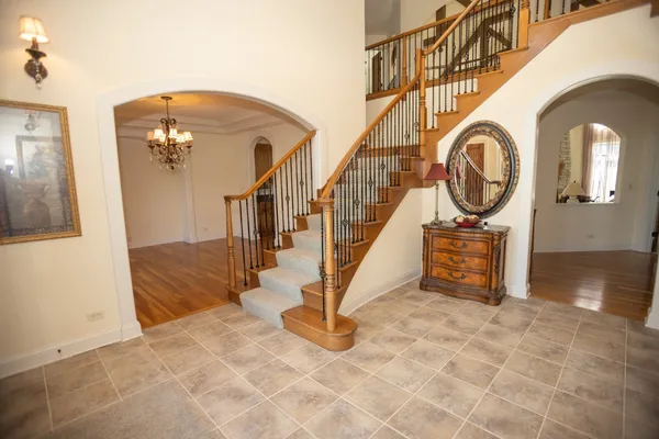 a view of an entryway with wooden floor