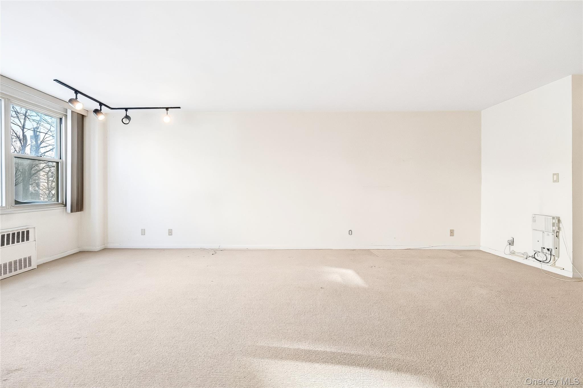 12 Old Mamaroneck Road, Unit 2G White Plains, NY 10605 - Photo 13 of 38 a view of a room with racks on the wall