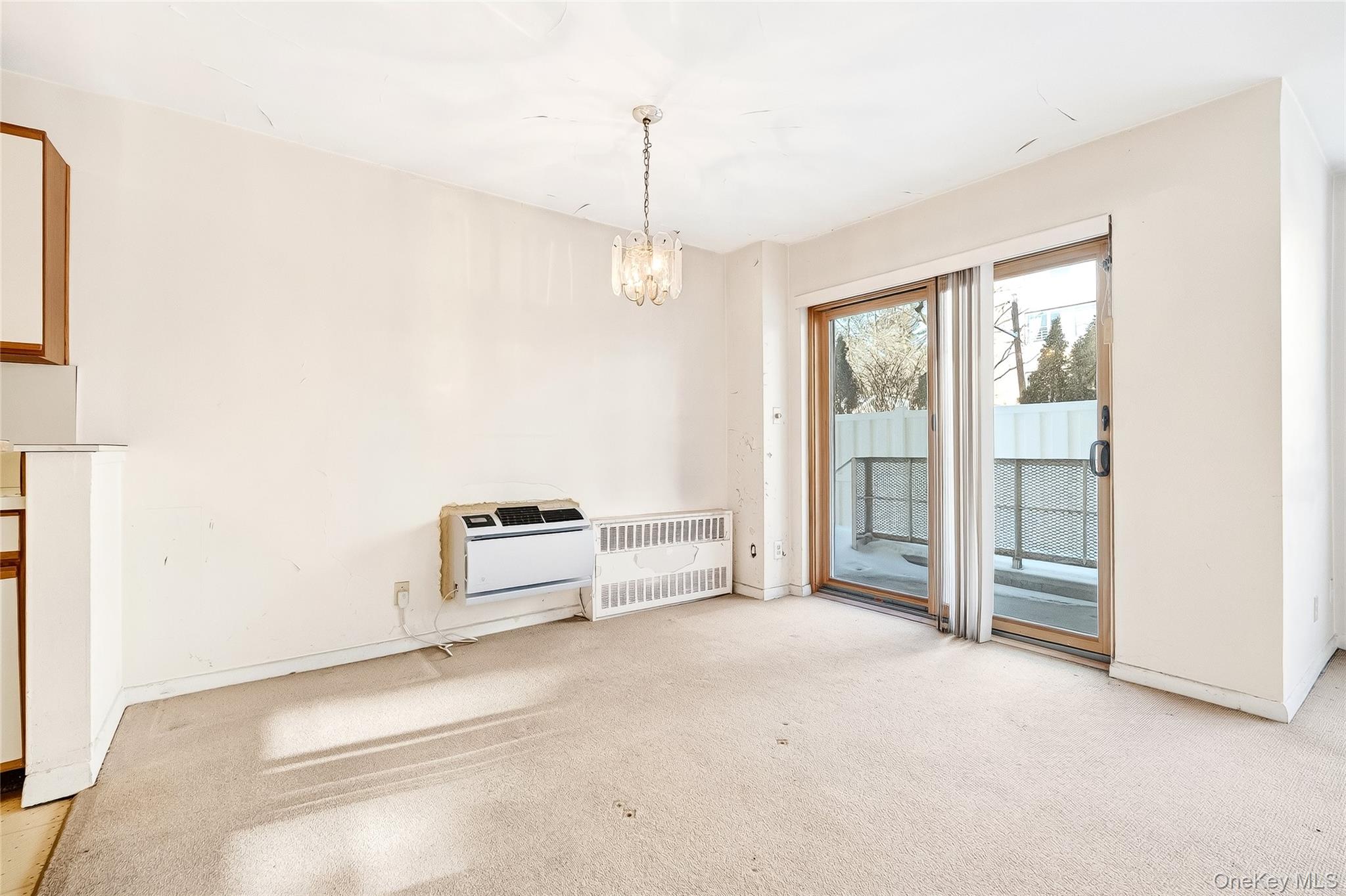 12 Old Mamaroneck Road, Unit 2G White Plains, NY 10605 - Photo 14 of 38 an empty room with windows and ceiling fan