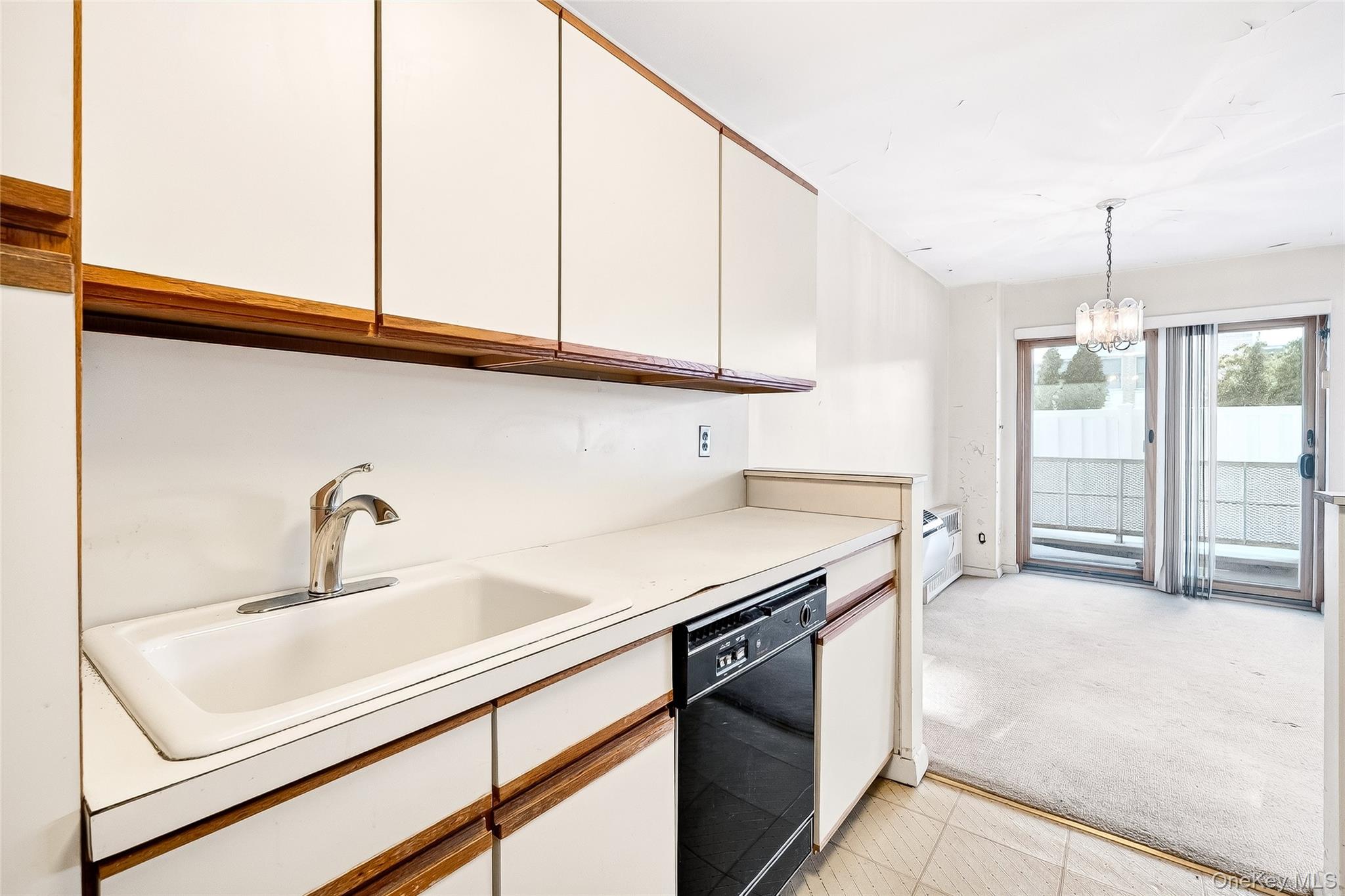 12 Old Mamaroneck Road, Unit 2G White Plains, NY 10605 - Photo 22 of 38 a kitchen with stainless steel appliances granite countertop a sink and a white cabinets