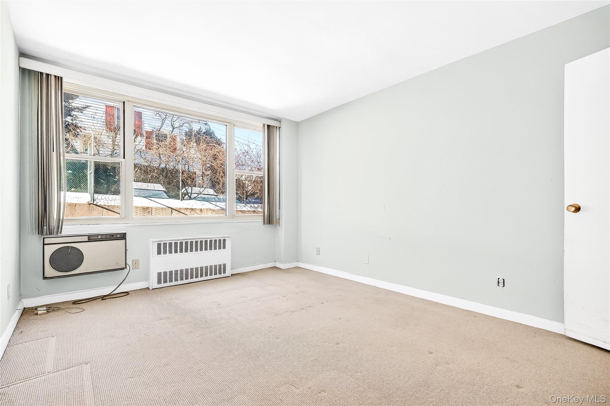 12 Old Mamaroneck Road, Unit 2G White Plains, NY 10605 - Photo 27 of 38 an empty room with windows