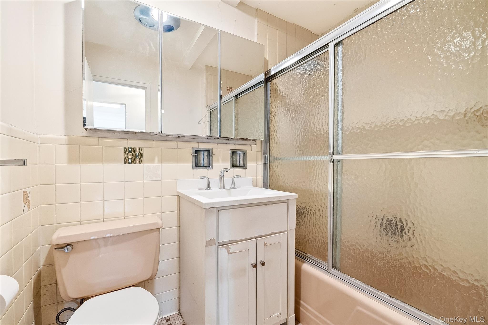 12 Old Mamaroneck Road, Unit 2G White Plains, NY 10605 - Photo 30 of 38 a bathroom with a sink a toilet and shower