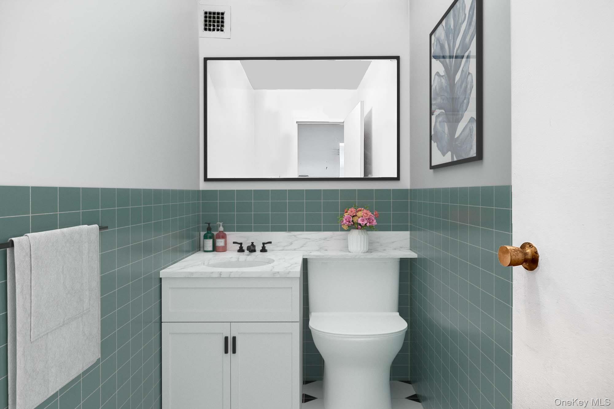 12 Old Mamaroneck Road, Unit 2G White Plains, NY 10605 - Photo 31 of 38 a bathroom with a sink mirror toilet and vanity