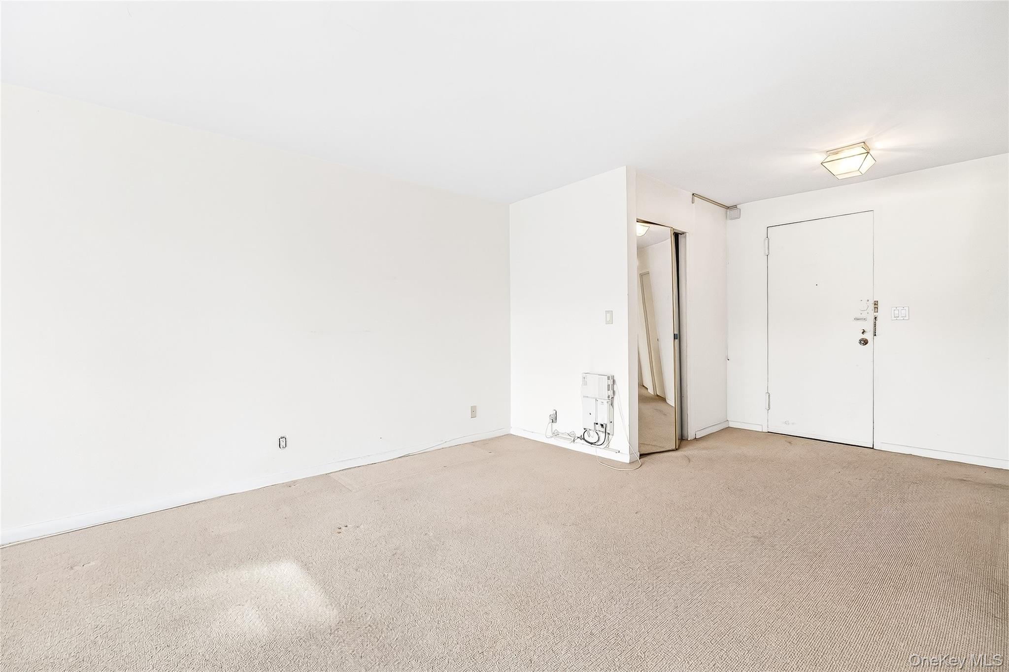 12 Old Mamaroneck Road, Unit 2G White Plains, NY 10605 - Photo 9 of 38 an empty room with an entryway