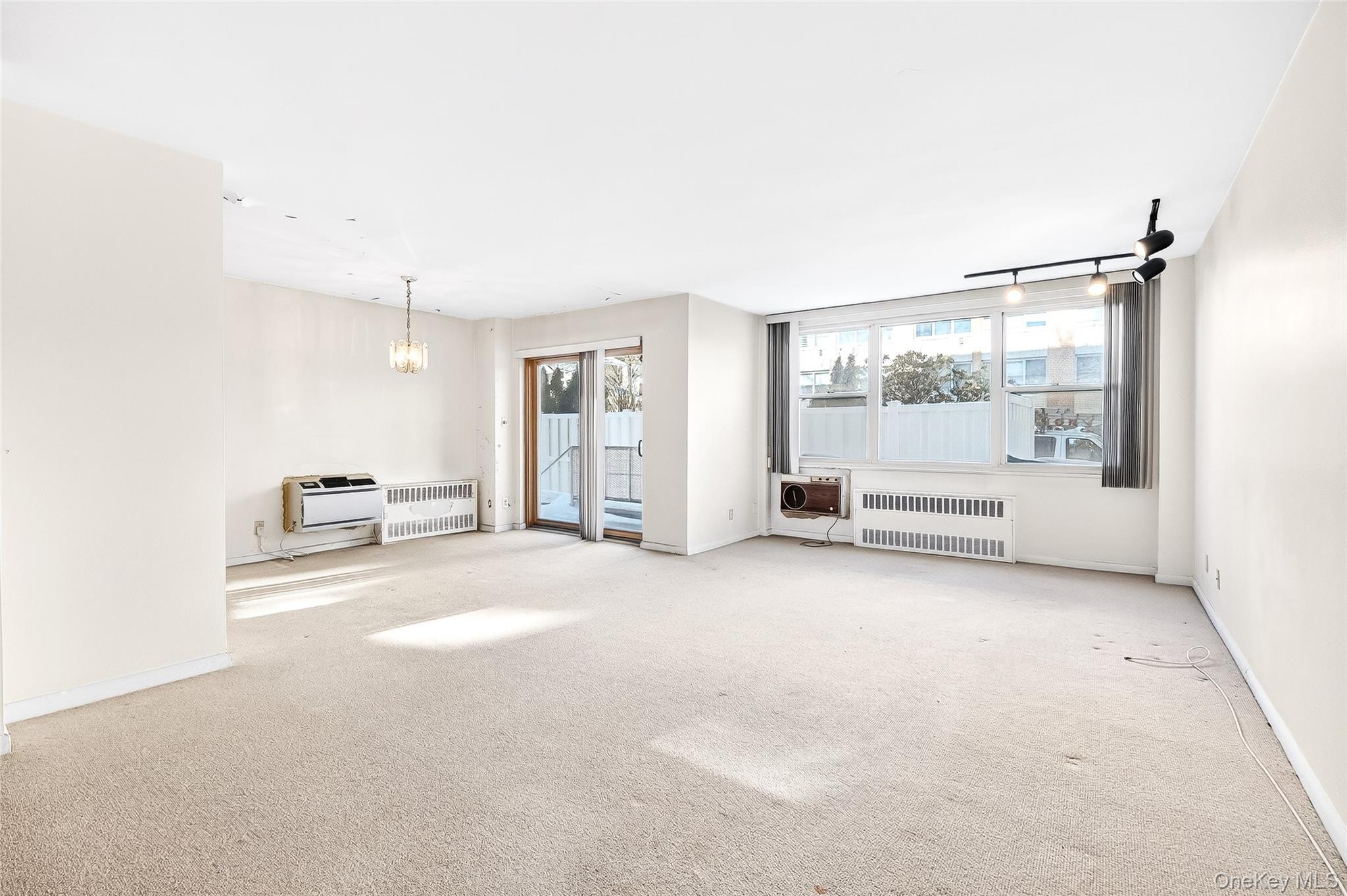 12 Old Mamaroneck Road, Unit 2G White Plains, NY 10605 - Photo 10 of 38 a view of empty room with floor to ceiling window