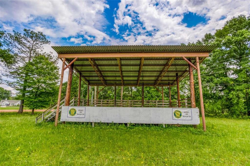 1320 East Church Street Monroe, GA 30655 - Photo 12 of 15 a view of a wooden fence with a bench in a park