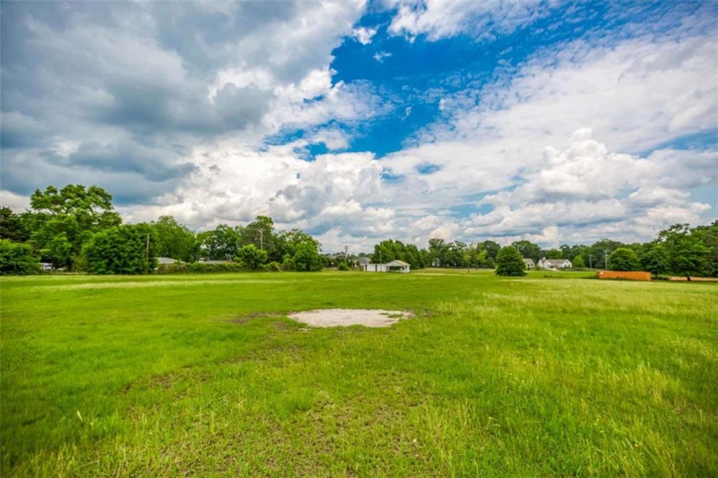 1320 East Church Street Monroe, GA 30655 - Photo 7 of 15 a view of a lake with a big yard
