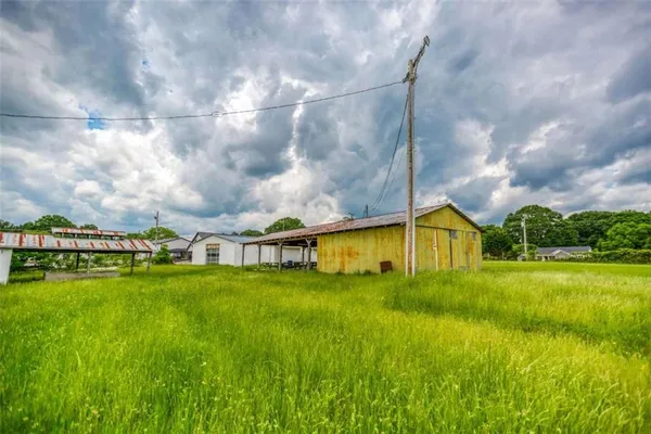 a view of a house with a big yard