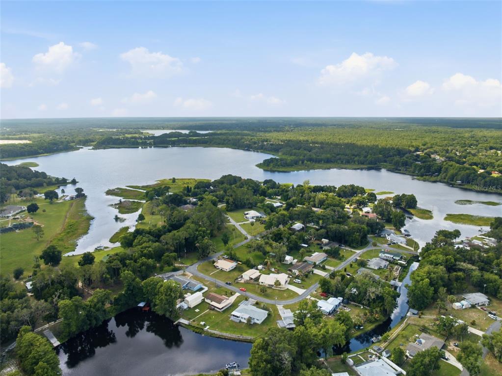 1830 South Mandarin Terrace Inverness, FL 34450 - Photo 33 of 47 a view of a lake with houses in the back