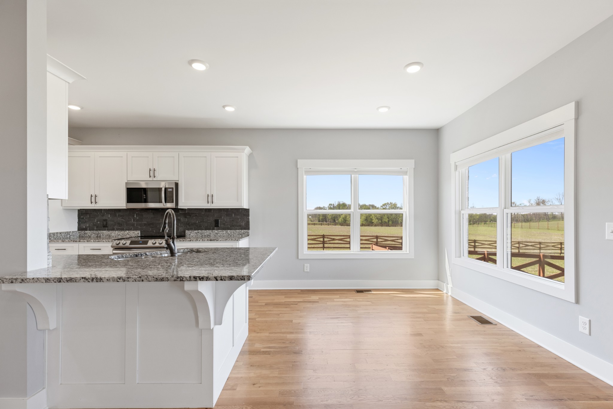 5450 Highway 431 Springfield, TN 37172 - Photo 14 of 54 a view of a kitchen with kitchen island a sink wooden floor and counter top space