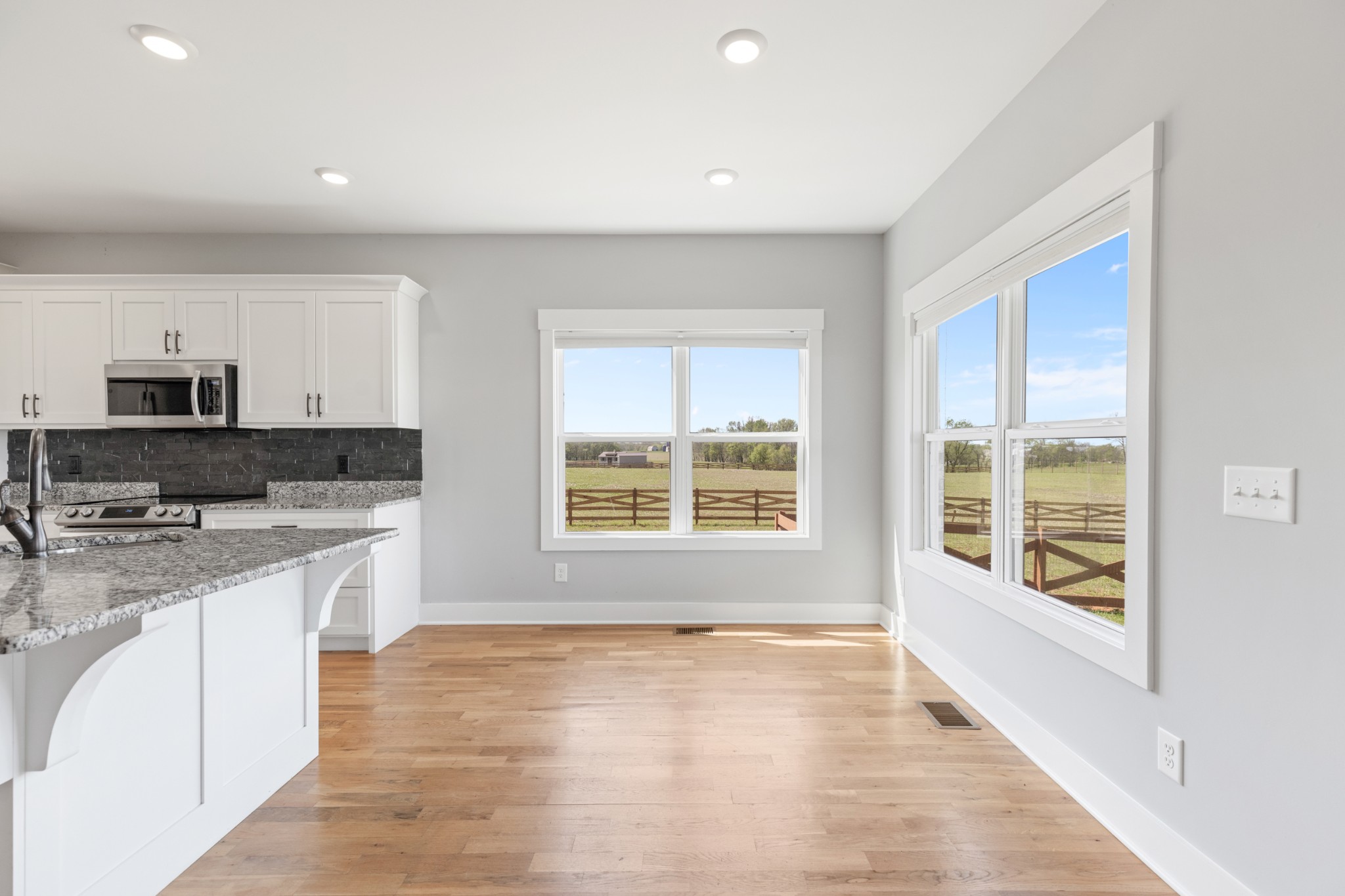 5450 Highway 431 Springfield, TN 37172 - Photo 15 of 54 a large kitchen with stainless steel appliances granite countertop a stove a sink and a microwave