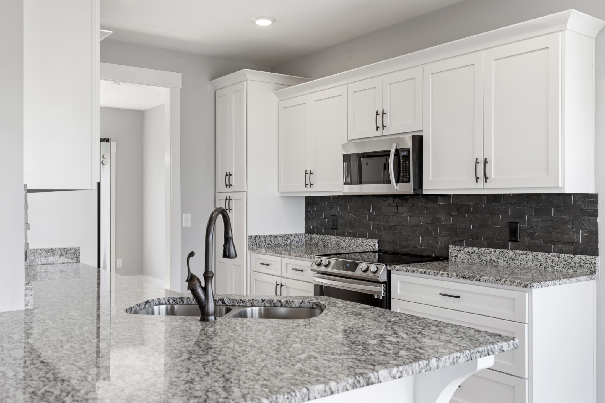 5450 Highway 431 Springfield, TN 37172 - Photo 17 of 54 a kitchen with stainless steel appliances granite countertop a sink stove and microwave