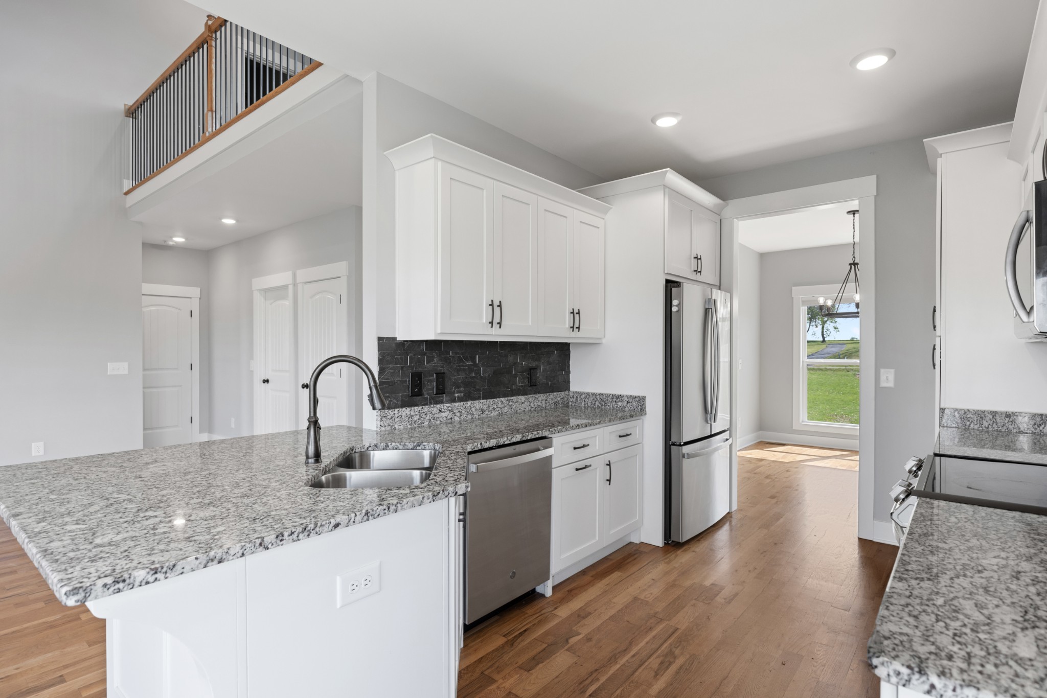 5450 Highway 431 Springfield, TN 37172 - Photo 19 of 54 a kitchen with granite countertop a refrigerator and a sink