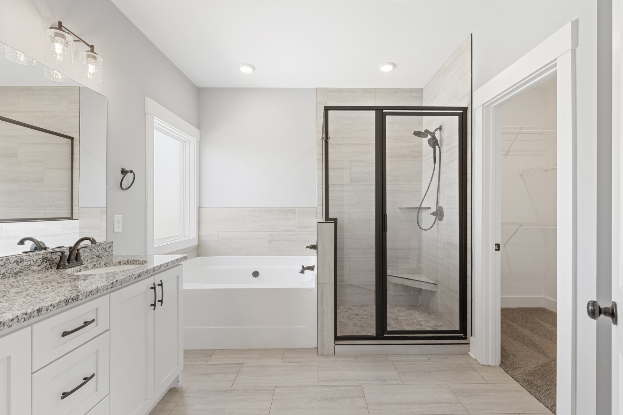 5450 Highway 431 Springfield, TN 37172 - Photo 26 of 54 a bathroom with a granite countertop sink a mirror a bathtub and shower