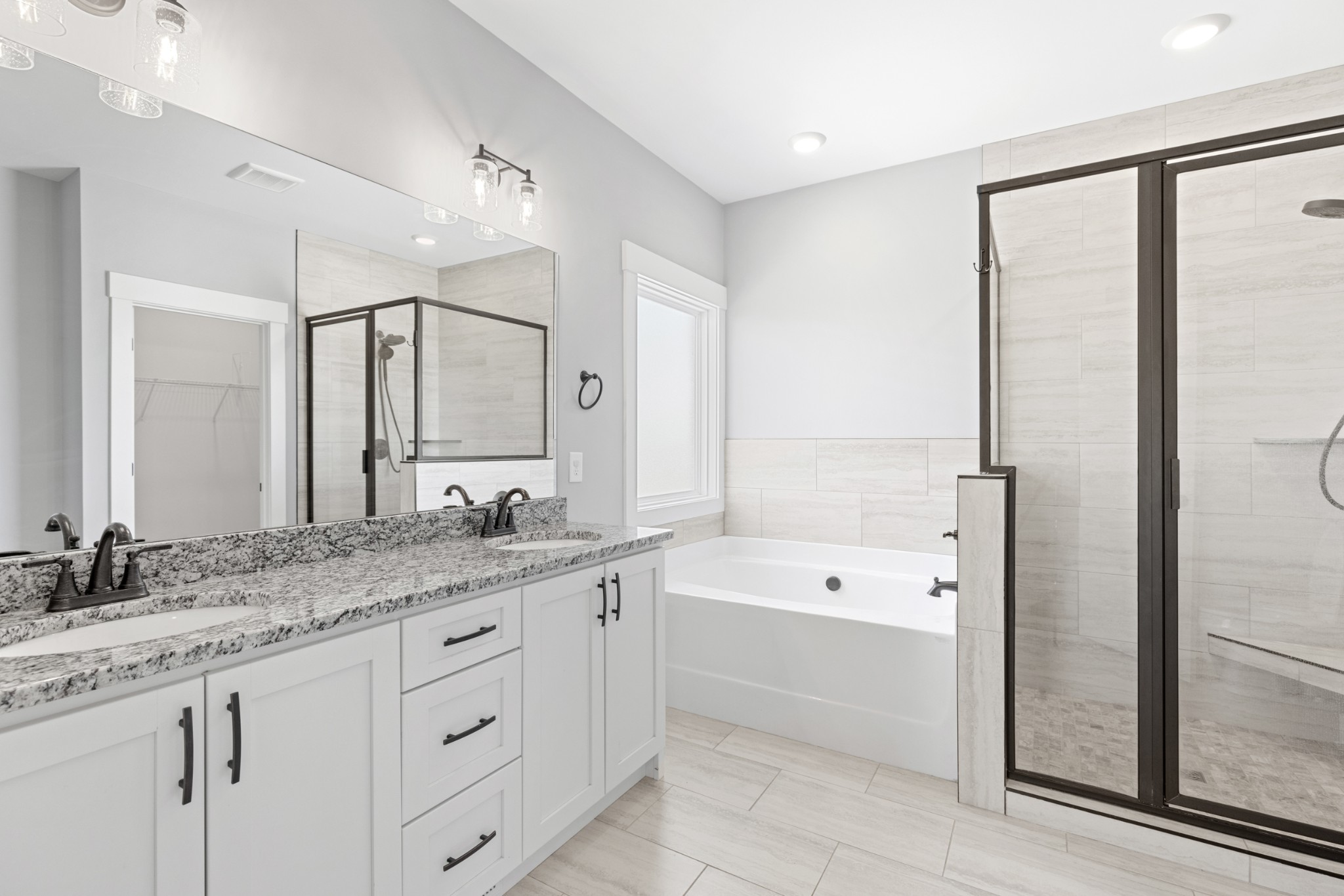 5450 Highway 431 Springfield, TN 37172 - Photo 27 of 54 a spacious bathroom with a granite countertop tub sink a mirror a shower and vanity