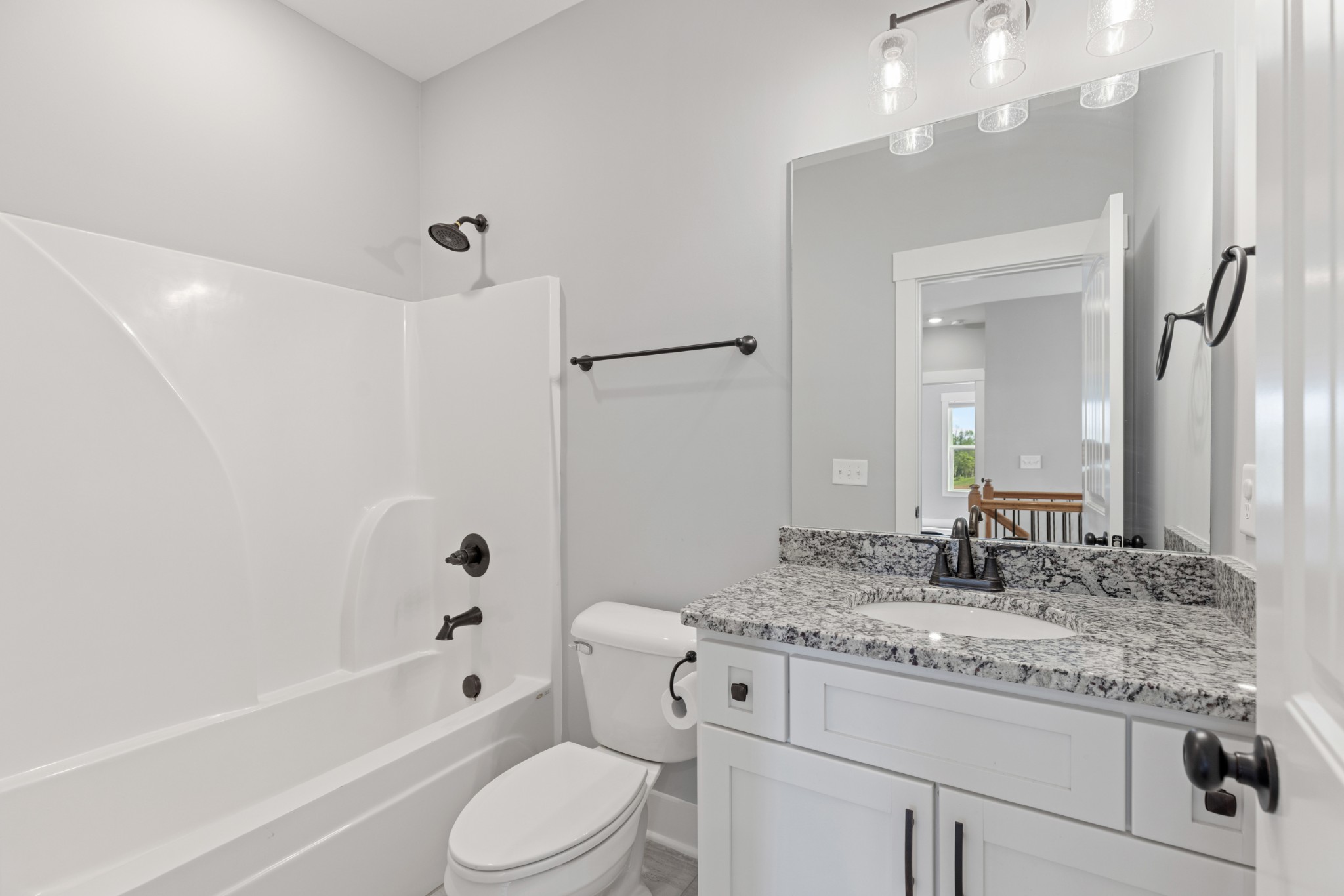 5450 Highway 431 Springfield, TN 37172 - Photo 38 of 54 a bathroom with a granite countertop sink a toilet and shower