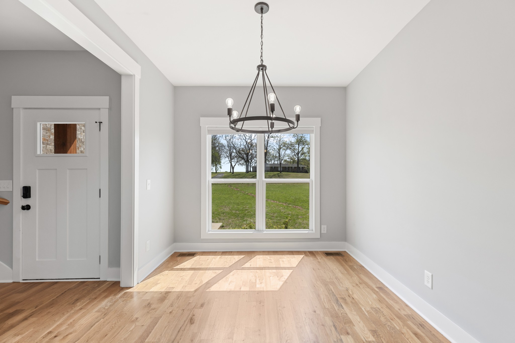 5450 Highway 431 Springfield, TN 37172 - Photo 9 of 54 a view of an empty room with wooden floor and a window