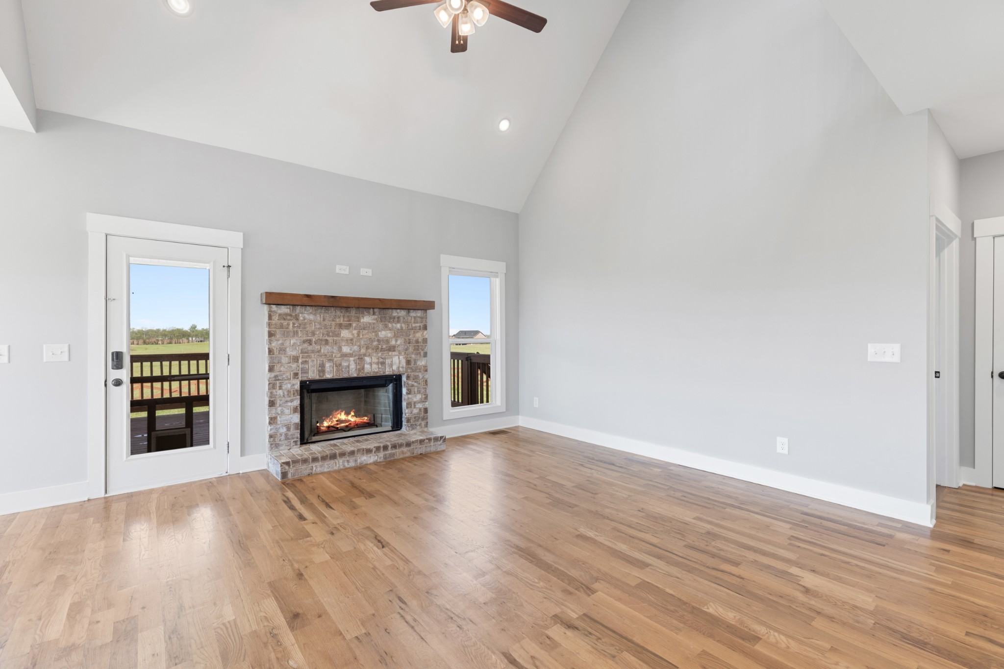 5450 Highway 431 Springfield, TN 37172 - Photo 10 of 54 an empty room with wooden floor fireplace and window