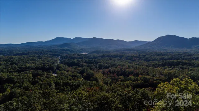 a view of a top of a house with a mountain view