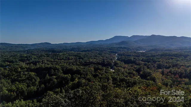 a view of a house with a mountain in the background