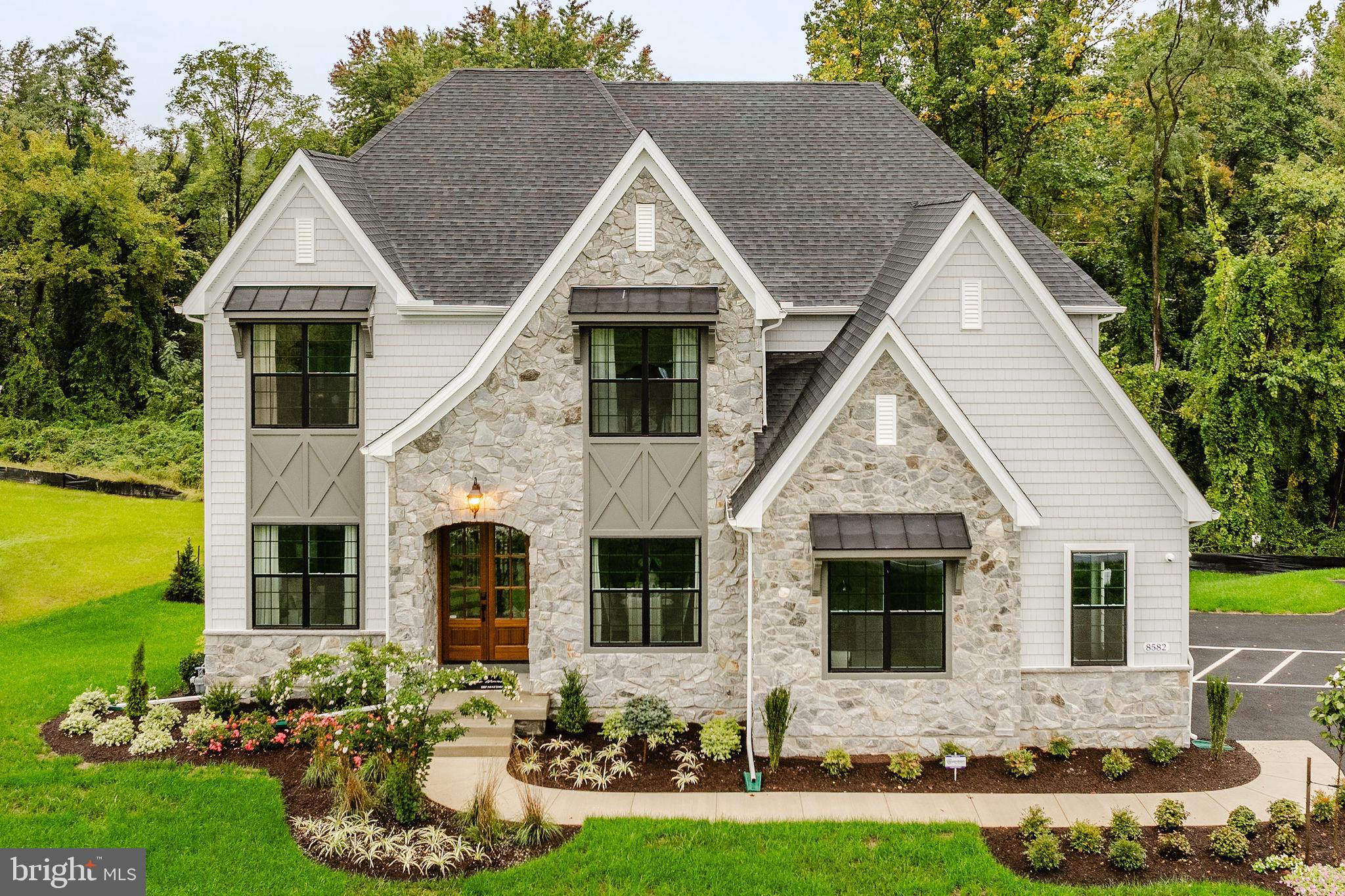 200 Gable Drive, Unit DEVONSHIRE Perkiomenville, PA 18074 - Photo 5 of 50 a front view of a house with garden