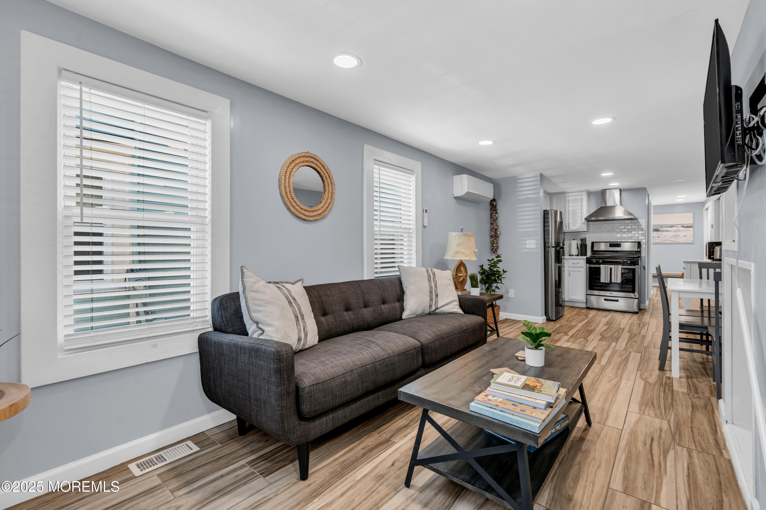 68 Clark Avenue, Unit 1E Ocean Grove, NJ 07756 - Photo 1 of 13 a living room with furniture and a wooden floor