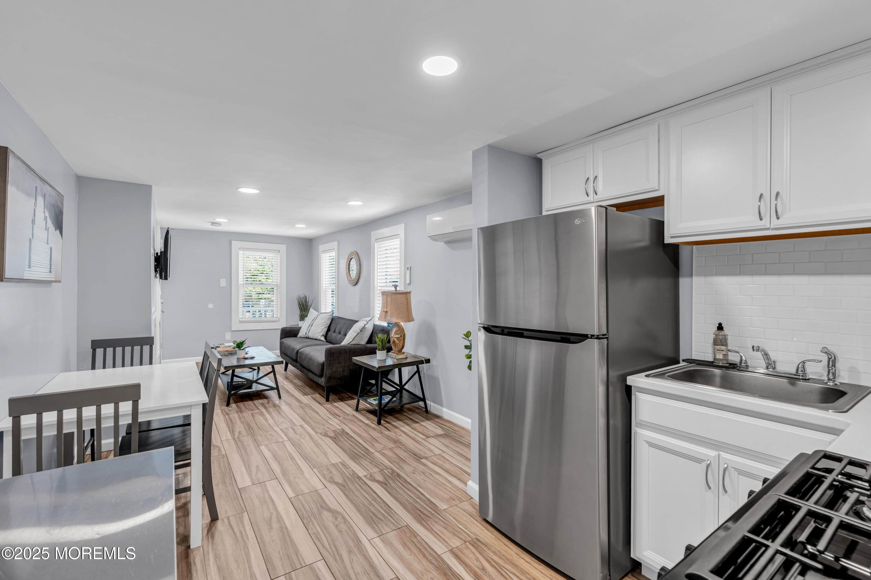 68 Clark Avenue, Unit 1E Ocean Grove, NJ 07756 - Photo 7 of 13 a kitchen with stainless steel appliances a refrigerator sink and cabinets