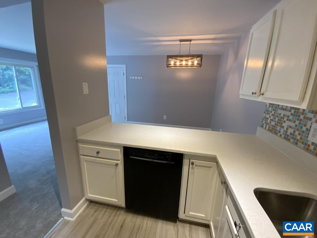 117 Berry Street, Unit 12 Orange, VA 22960 - Photo 2 of 10 a bathroom with a sink and a mirror