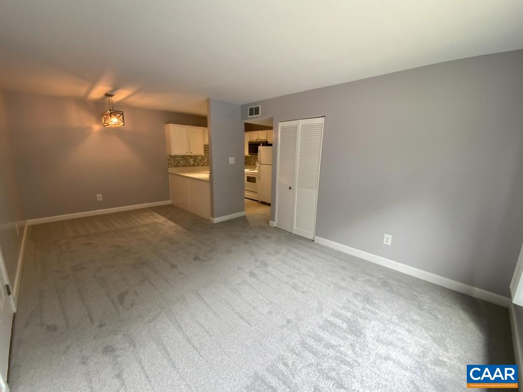 117 Berry Street, Unit 12 Orange, VA 22960 - Photo 3 of 10 a view of a room with a stylish ceiling fan and entryway