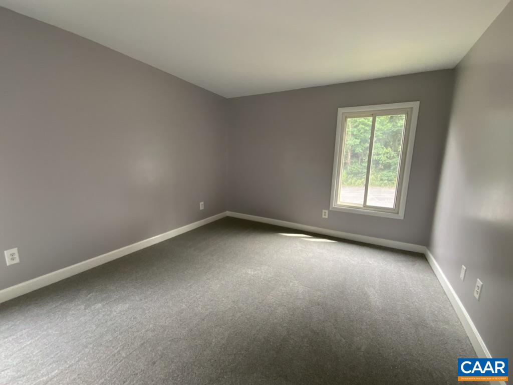 117 Berry Street, Unit 12 Orange, VA 22960 - Photo 5 of 10 an empty room with a window
