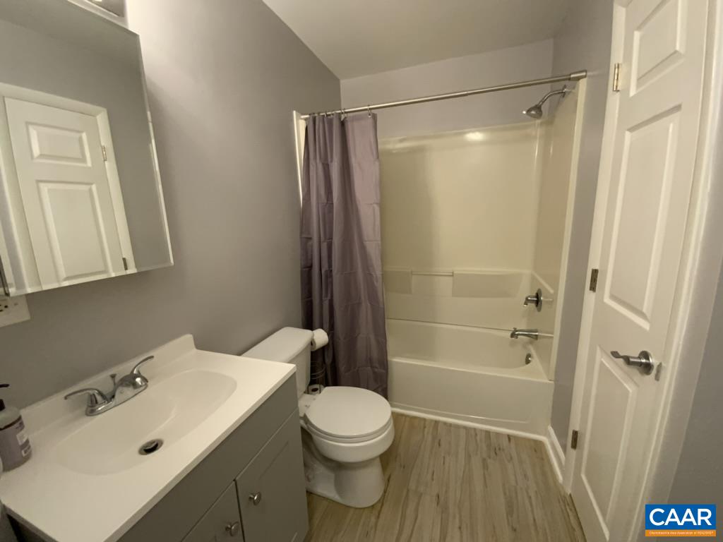 117 Berry Street, Unit 12 Orange, VA 22960 - Photo 9 of 10 a bathroom with a sink toilet and shower