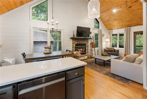 a view of a balcony with floor to ceiling windows with wooden floor