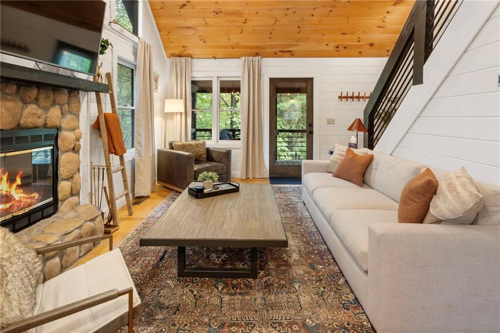 120 Brookhaven Trail Blue Ridge, GA 30513 - Photo 19 of 93 a living room with furniture and a fireplace