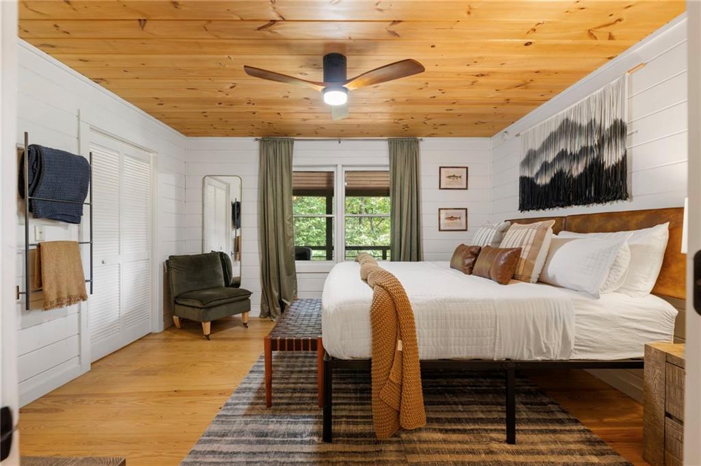120 Brookhaven Trail Blue Ridge, GA 30513 - Photo 24 of 93 a bedroom with a bed wooden floor and window