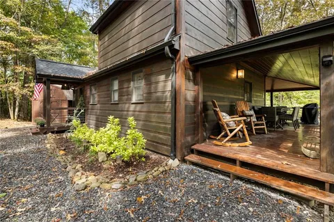 a outdoor dining space with furniture and outdoor view