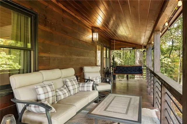 a dining room with furniture and wooden floor