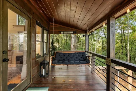 a dining room with furniture and wooden floor