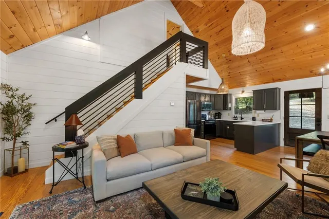 a spacious bedroom with a bed and a couch