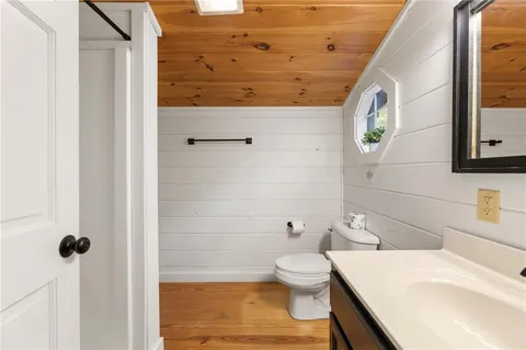 a view of a tree in a yard