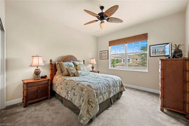 a bedroom with a bed dresser and a window